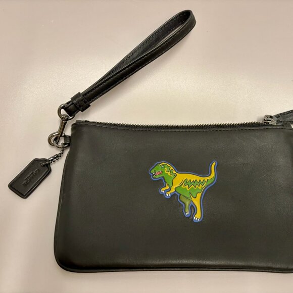 Black leather Coach wristlet with embossed Tyrannosaurus Rex - Picture 2 of 5